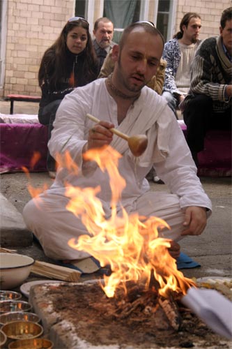 ... while Sriman Krishna Bhakta Prabhu is offering ghi to the sacred fire.