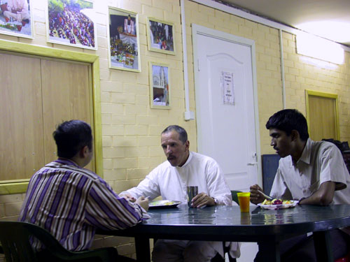 After the arati and class, Sripad Srutasrava Prabhu was talking with Indian student guests during prasadam ditrubution